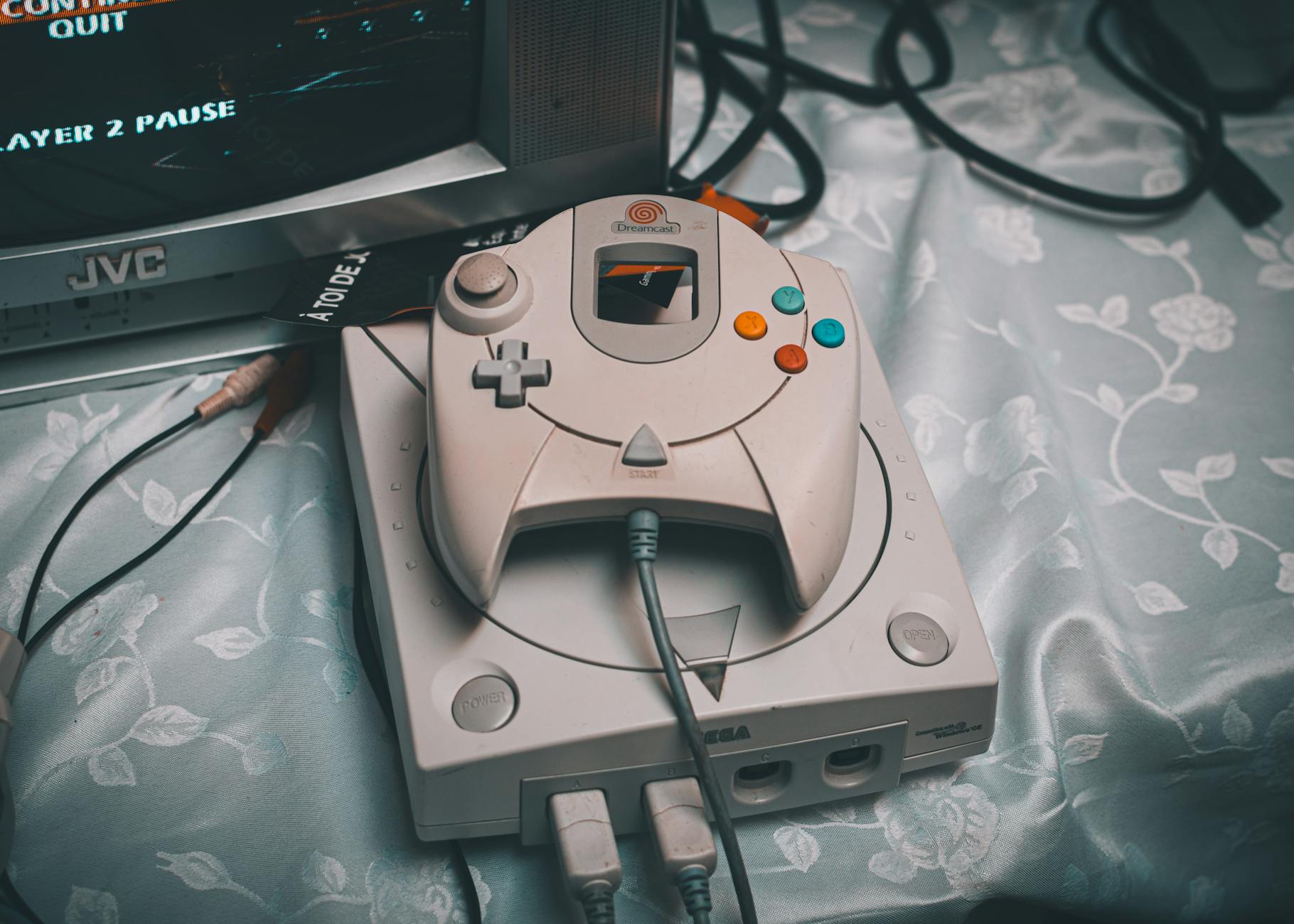 dreamcast console with controller on vintage setup
