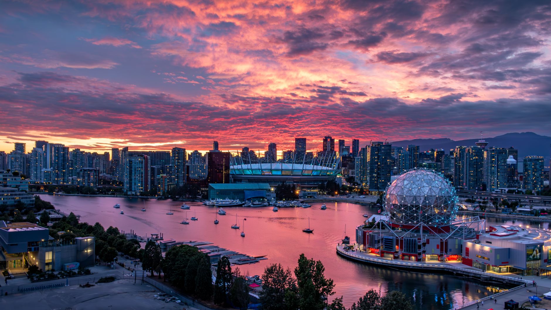 a colorful sunset over the city of vancouver
